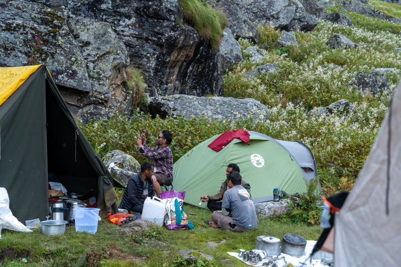 Mountain camp at night with warm lights, representing The Mountain Canteen outdoor food collection