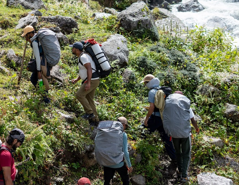 Mountain camp at night with warm lights, representing The Mountain Canteen outdoor food collection